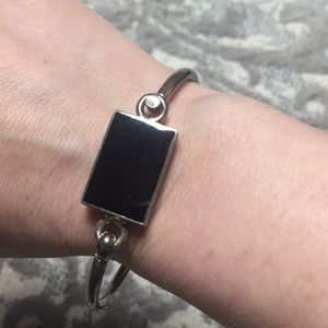 Silver bangle with black enamel